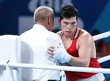 Aibek Oralbay receives gratulations from the referee