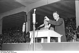 Billy Graham, a prominent evangelical revivalist, preaching in Duisburg, Germany in 1954