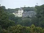 a large house surrounded by trees