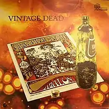 A poster for a Grateful Dead concert on a psychedelic orange background with an open bottle
