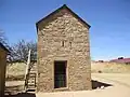 The Jowell House (1872-1873) from Palo Pinto County is a fortress style residence, with an outside ladder to the second floor.