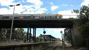 A tram crossing the bridge above Goodwood station in 2010