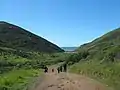 People walking on Tennessee Valley trail to the beach