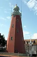 Portland Observatory in 2005, a tall, red, lighthouse-like structure with a windowed dome on top.