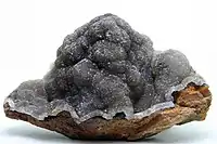 Galena crystals with siderite and greenalite. Corta San Valentin, Cartagena  Smithsonite on iron oxides, Lirio Mine, Cartagena.  Amethyst crystals on manganese oxides. Catón Mine, Cartagena  Baryte, Teresita mine, Cartagena.