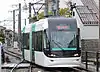 An TLR0600 train on the Toyama Light Rail Toyama Port Line in 2015