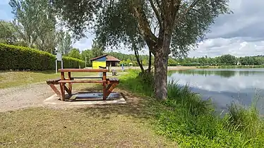 Picnic table next to a lake