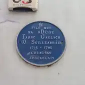 Blue plaque commemorating Tadhg Gaelach Ó Súilleabháin, poet, at Waterford County Waterford