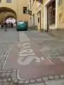 Šariš Brewery logoon the sidewalk in Prešov