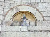 A fresco above the secondary entrance