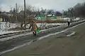 Residents carrying water following the start of the battle in late January 2015