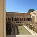 A big rectangular howz in a traditional Iranian house