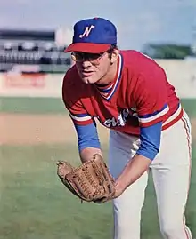 A baseball player in red, white, and blue