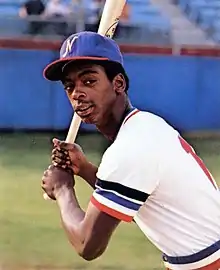 A baseball player in white