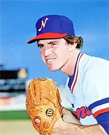 A baseball player in white