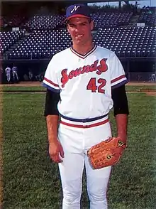 A baseball player in white