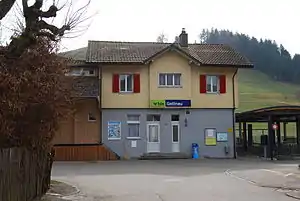 Two-story building with gabled roof