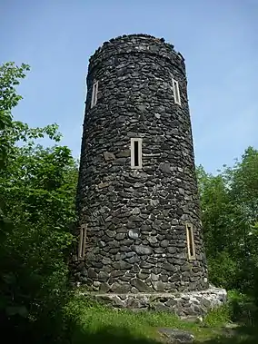 Rough-hewn stone tower