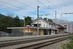 Two-story white building with slanted roof