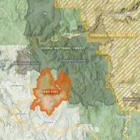 The footprint of the Oak Fire is shown in orange against the Sierra National Forest in green. Yosemite National Park is shown well east, in golden stripes.