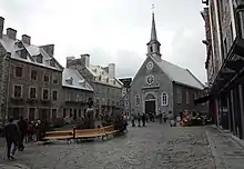 View of the Place Royale in Quebec City, with the facade of the Notre-Dame-des-Victoires church.