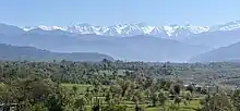 A panoramic vista capturing the majestic Pir Panjal mountain range (Lower Himalayas) as seen from Tatrinote, AJK.