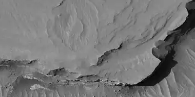 Close view of layers, as seen by HiRISE under HiWish program At least one layer is light-toned which may indicated hydrated minerals.