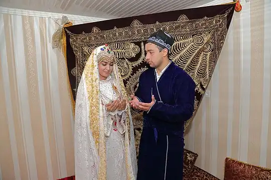 A bride and groom in traditional clothes