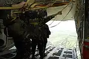 Airmen of the 710th Special Operations Wing prepare to jump from a KC-130 during Parachute Operations training.