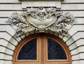 Two Beaux Arts mascarons of Avenue Henri-Martin no. 87, Paris, designed by Albert Walwein, 1892