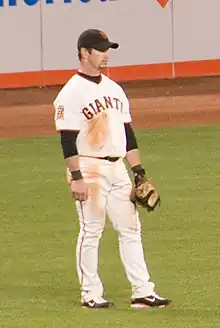 Aaron Rowand, playing with the San Francisco Giants, stands in the outfield.