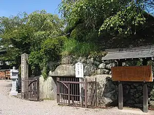 Entrance to an underground structure built of rough stones.