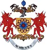 Before 1975, the motto on the coat of arms was different - OM MANI PADME HUM. (Oh, the jewel of creation is in the Lotus).