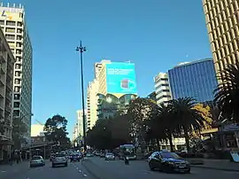 Dual carriageway road in between office buildings