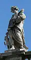 The saint's statue is among those on the colonnade in St. Peter's Square.