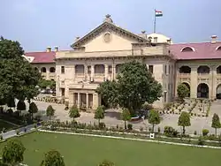 Large building behind landscaped grounds