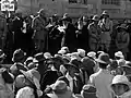 From left to right (holding papers): Weizmann, Allenby and the Chief Rabbi of Jerusalem delivering a speech.