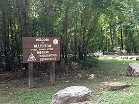 A sign along the road in Allenton Access