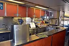 Stainless steel counter with stacked food items