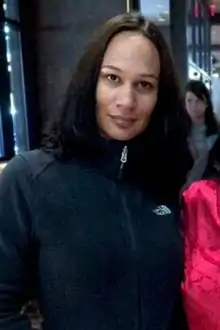 A picture of Amil in a gray zip-up jacket