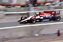 Andrea de Cesaris drives the JS23 chassis at the 1984 Dallas Grand Prix.