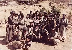 Group of about 20 Iraqi soldiers, posing with guns