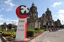 The anti-monument presents a dove soaring, with "1968" written on the bottom, "2 October, it is not forgotten" and "It was the army, it was the state" slogans.