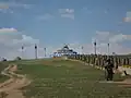 Elaborate ovoo with prayer wheels leading to it in Hohhot, Inner Mongolia, China