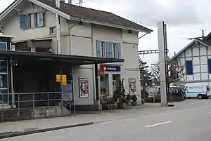 Three-story building with gabled roof