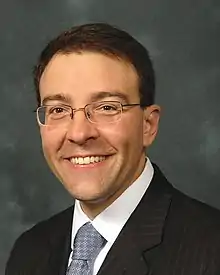 Head and shoulders of a Caucasian man wearing a suit