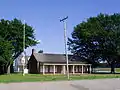 Historic house sits beside a road