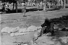 An Armenian mother beside her children's corpses