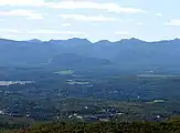 Lake Placid village, foreground, Armstrong Mountain and Gothics from McKenzie