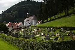 Church of Saint James with adjacent rectory and cemetery